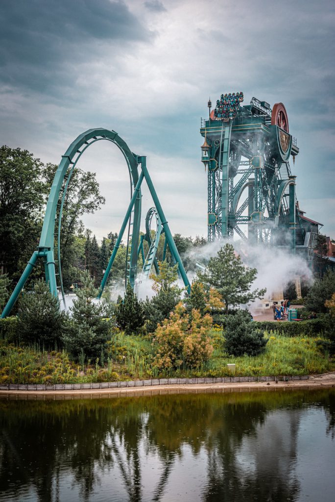 blue roller coaster on green grass field during daytime efteling